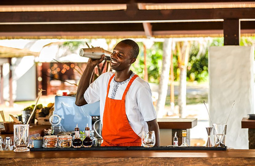 Bartender whips up cocktails