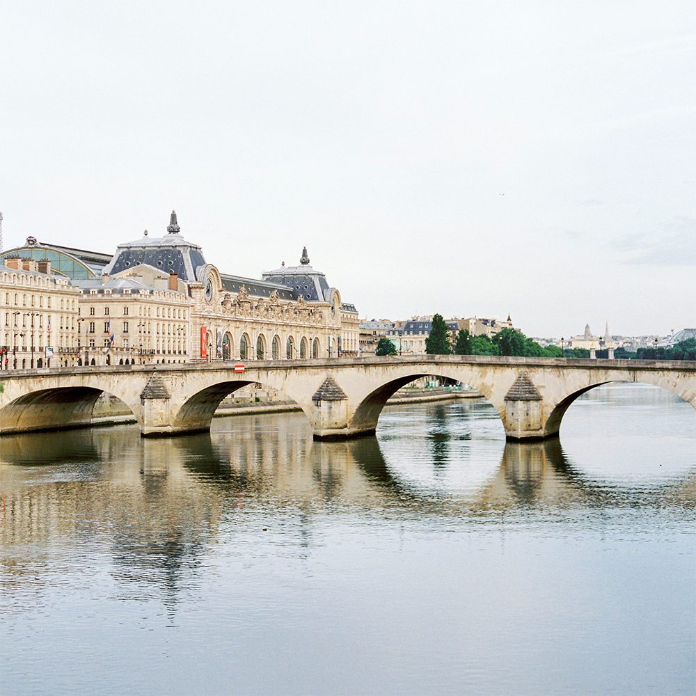 Bronze lions stand guard at the entrance to the Louvre, photo by Analui