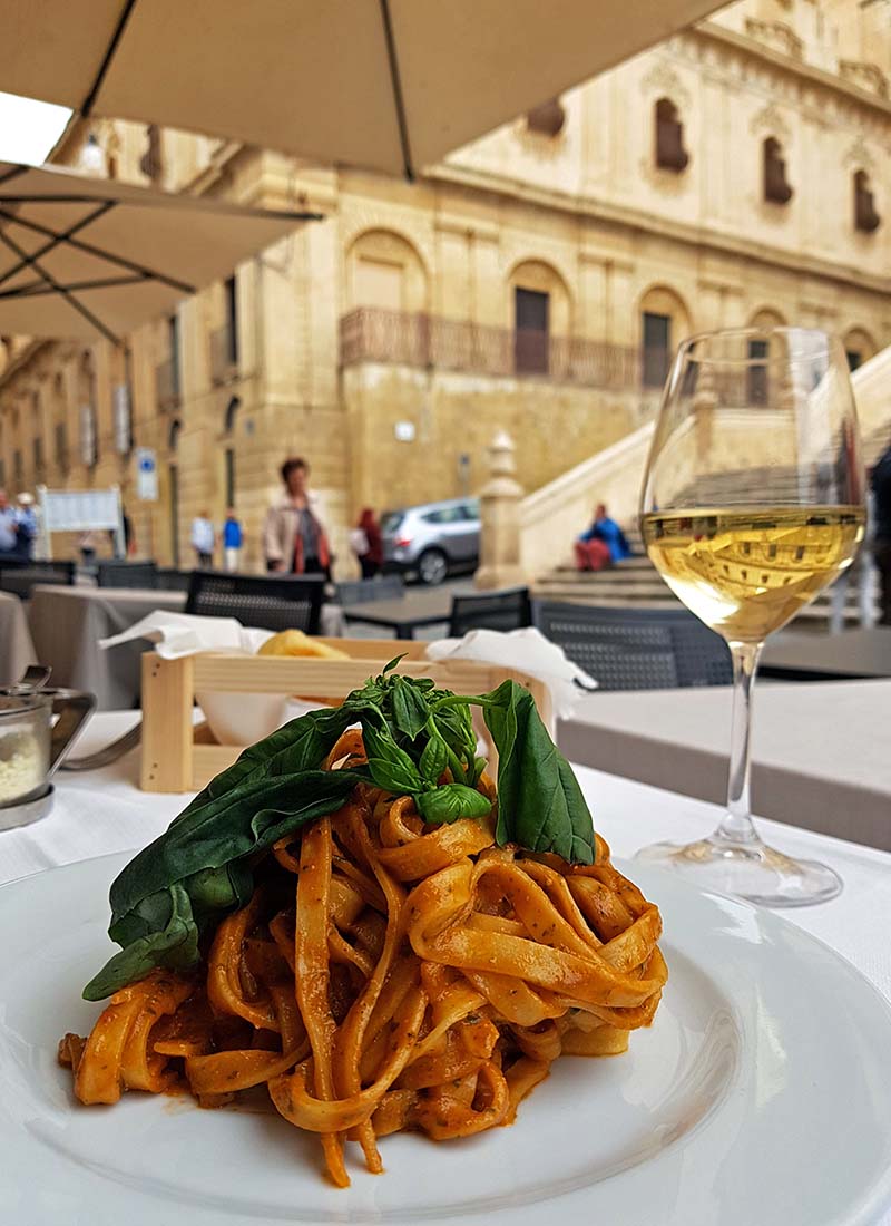 A leisurely meal at a restaurant in Noto, Sicily, Image by tsvetomira, Shutterstock