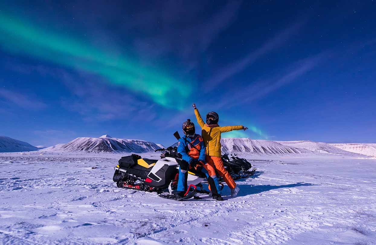 Snowmobile the moon mountains in Norway Svalbard, Image by ginger_polina_bublik, Shutterstock