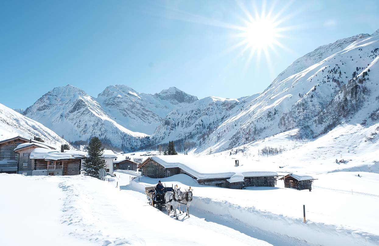 In true winter wonderland fashion indulge in a horse carriage ride in snow when at Davos Klosters, Image Copyright Marcel Giger